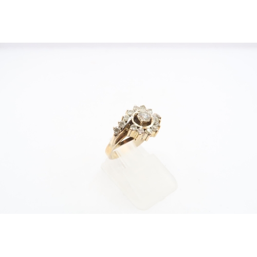 44 - A diamond crossover cluster ring. Tests gold 14ct. Size K 1/2. Weight 4.08 grams