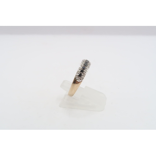 47 - A 9ct gold black diamond and diamond eternity ring. Size P 1/2. Weight 1.86 grams
