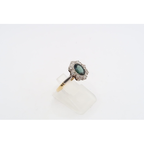 49 - An oval sapphire and diamond cluster ring. Stamped 18ct. Size S. Weight 2.95 grams
