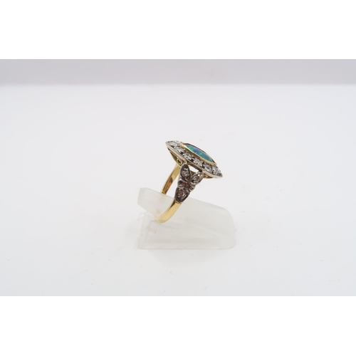 53 - A marquise shape opal (possibly synthetic) and and brilliant cut diamond cluster ring. Tests gold 18... 