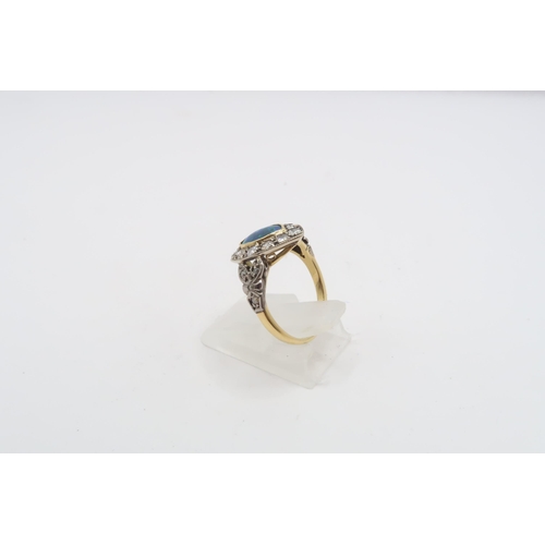 53 - A marquise shape opal (possibly synthetic) and and brilliant cut diamond cluster ring. Tests gold 18... 