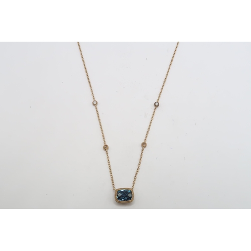 58 - A 9ct gold blue topaz and diamond pendant. Weight 1.98 grams