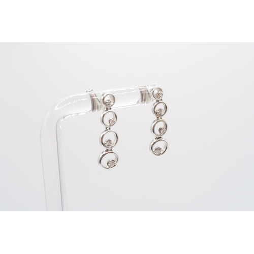 60 - A pair of 18ct diamond circle ear drops. Length 22mm. Weight 3.63 grams