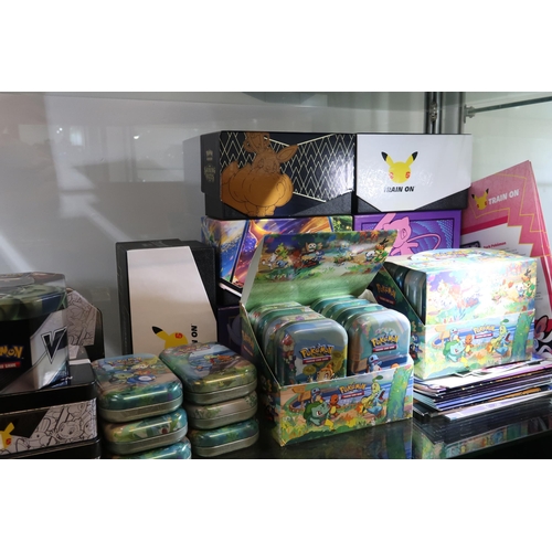506 - A Miscellaneous group of Pokémon Tins, Boxes and cases from different issues such as 25th Celebratio... 