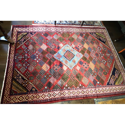 559 - A hand knotted woollen Baluchi rug - 3.00m x 2.18m