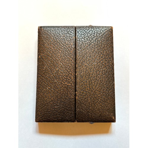 487 - A 19th-century Painted Gold Metal Rimmed Portrait Miniature housed within a fitted brown velvet case