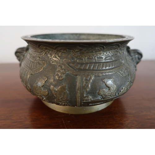  A 19th Century heavy bronze Chinese censer. featuring a globular form with a flared floral engraved ... 
