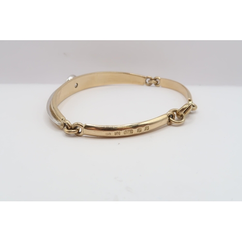 20 - A 9ct bi colour bracelet collet set with a brilliant cut diamond. Estimated 1.60cts I/J colour, SI2/... 