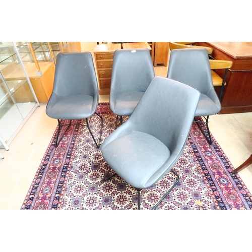 563 - A set of four modern dining chairs with grey upholstered seats