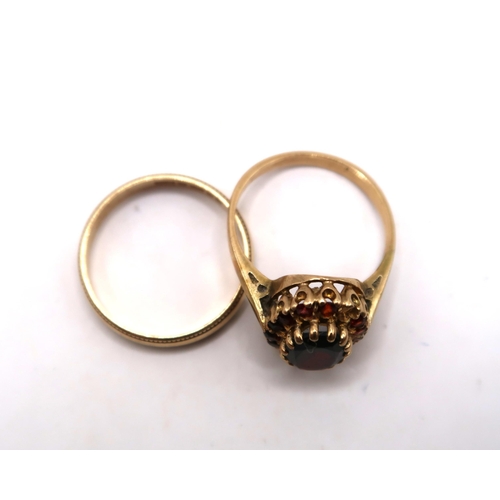 37 - A 9ct gold 3.5mm wedding band. Size Q 1/2. Weight 2.07 grams. Together with an oval garnet cluster r... 