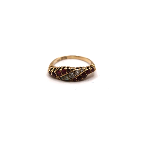 40 - An early-mid 20th century ruby and old cut diamond dress ring. Size N 1/2. Stamped 18ct. Weight 3.23... 