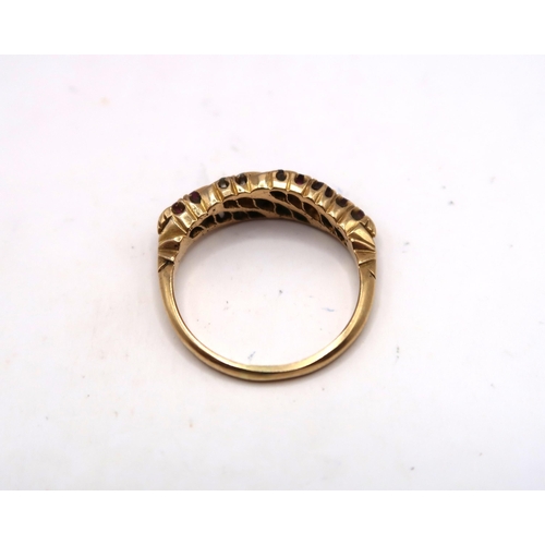 40 - An early-mid 20th century ruby and old cut diamond dress ring. Size N 1/2. Stamped 18ct. Weight 3.23... 