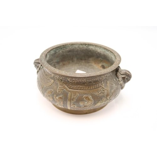 404 - A 19th Century heavy bronze Chinese censer. featuring a globular form with a flared floral engraved ... 