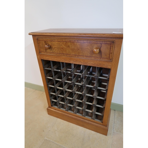 561 - A good quality burr oak wine rack with a drawer over a 36 bottle rack, 70cm wide x 94cm high