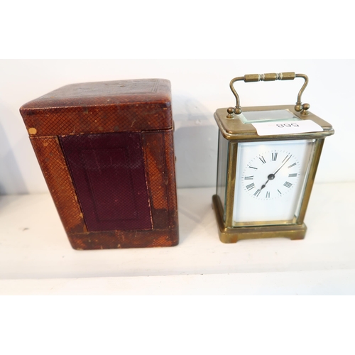 A 19th century small carriage clock and case - working in the saleroom