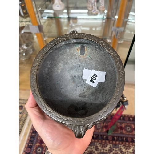 404 - A 19th Century heavy bronze Chinese censer. featuring a globular form with a flared floral engraved ... 