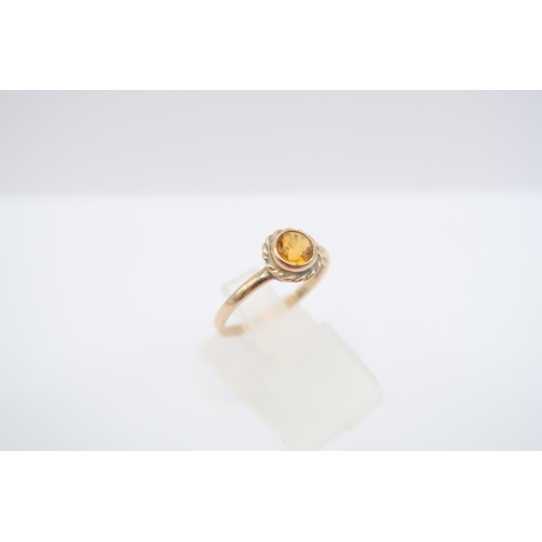  A 9ct gold citrine single stone ring. Size M 1/2. Weight 1.14 grams