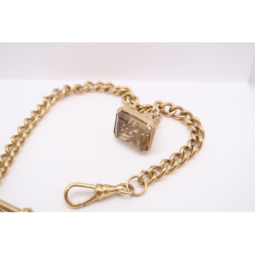  A 9ct gold Albert chain with t-bar, fob charm and toggle. Weight 23.56 grams