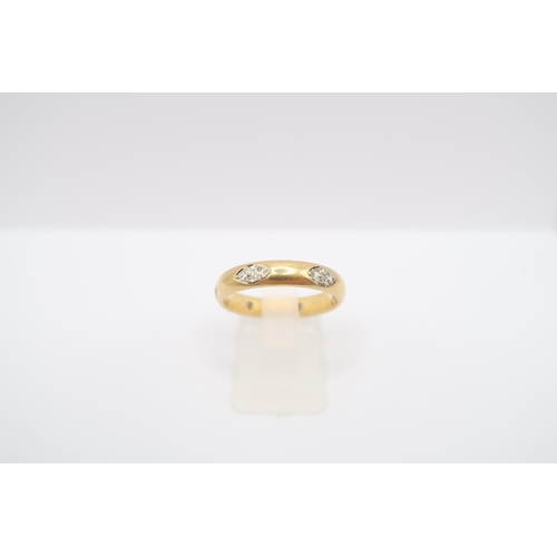  An 9ct gold band ring with three pave set diamond oval panels. Size O 1/2. Weight 4.83 grams