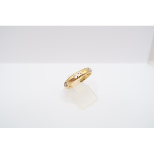  An 9ct gold band ring with three pave set diamond oval panels. Size O 1/2. Weight 4.83 grams