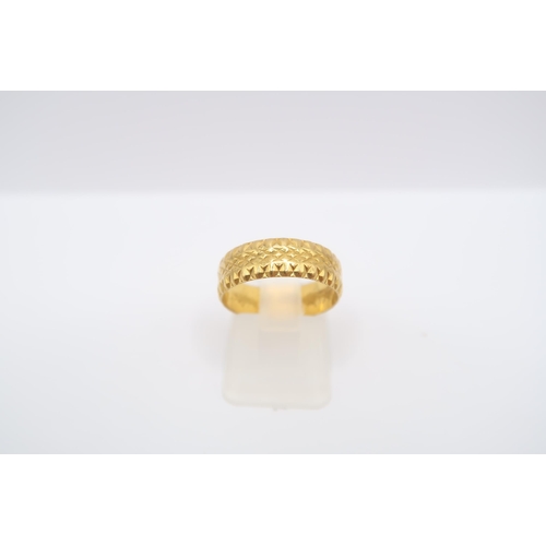  A 22ct textured band ring. Size N. Weight 3.73 grams