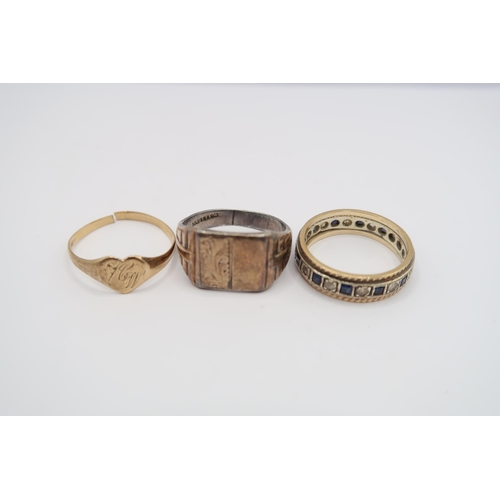  A group of three rings to include: A 9ct heart shape signet ring, split band. Weight 1.12 grams. A 9... 