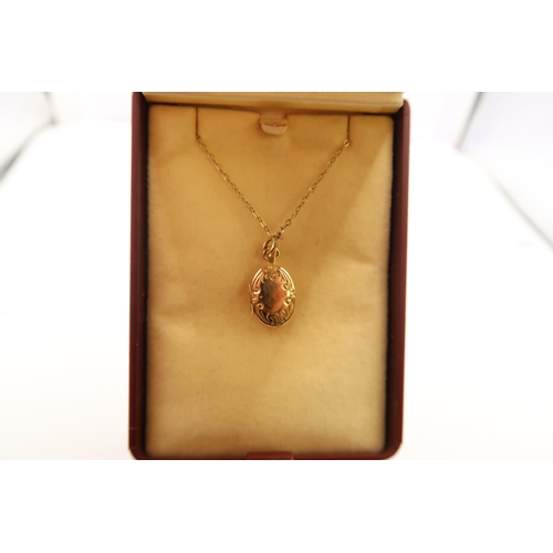  A 9ct gold oval locket suspended from a belcher link chain. Weight 1.45 grams