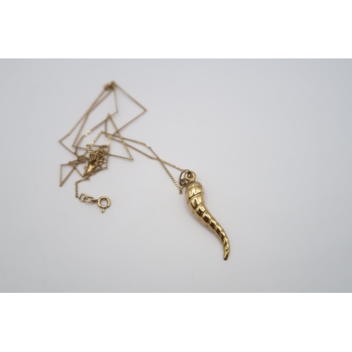  A spiral pendant and chain. Tests 9ct. Weight 1.54 grams