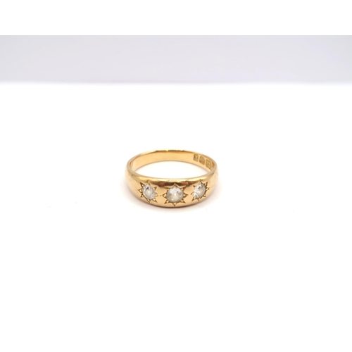 66 - An 18ct gold old cut diamond three stone band ring. Estimated 0.50ct. Size S. Weight 5.45 grams