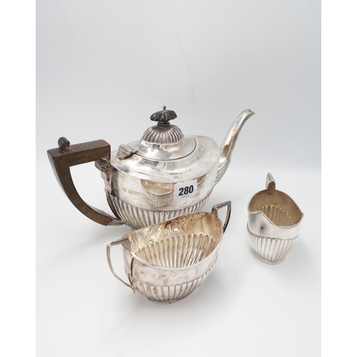 A Hallmarked Silver Teapot, Assayed Chester 1915 together with Creamer and Sugar Bowl. 