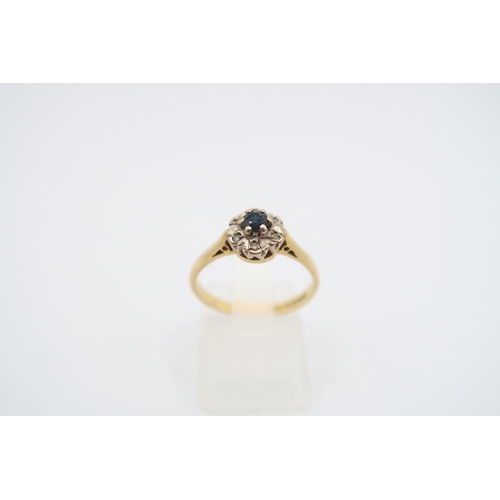  An 18ct Sapphire & Diamond Cluster Weight: 2.61g Size: L