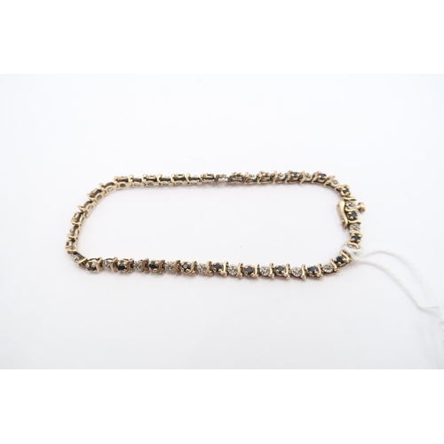  A 9ct Illusion Set Diamond & Sapphire Tennis BraceletLength: 19cm Weight: 6.5g