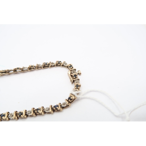  A 9ct Illusion Set Diamond & Sapphire Tennis BraceletLength: 19cm Weight: 6.5g
