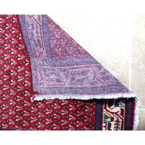 576 - A hand knotted woollen Araak runner - 2.0m x 0.75m