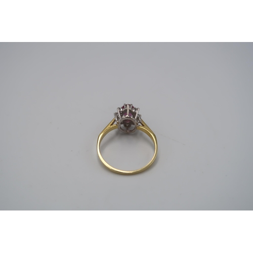 129 - An 18ct Yellow Gold Oval Ruby and Diamond Ring, Diamonds are a Good Colour and&nbsp;Clarity and Well... 