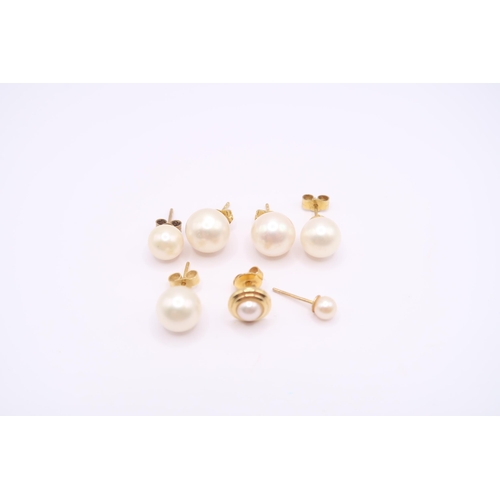 132 - A group of cultured pearl ear studs to include three pairs and two single studs. Tests 9ct and 18ct.... 