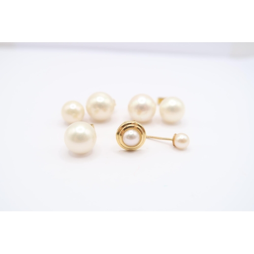 132 - A group of cultured pearl ear studs to include three pairs and two single studs. Tests 9ct and 18ct.... 