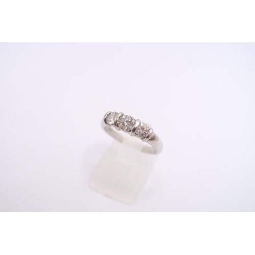 136 - A platinum brilliant cut diamond three stone ring. Estimated 0.80ct. Estimated G/H VS. Size K 1/2. W... 