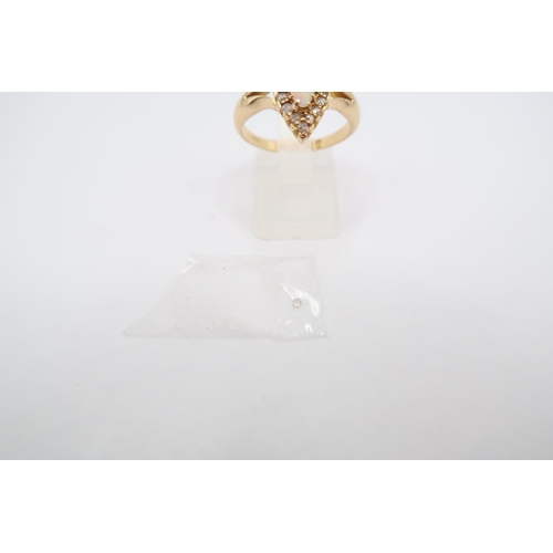 186 - An 18ct gold marquise opal and diamond cluster. Size Q. Weight 4.81 grams. One diamond requires rese... 