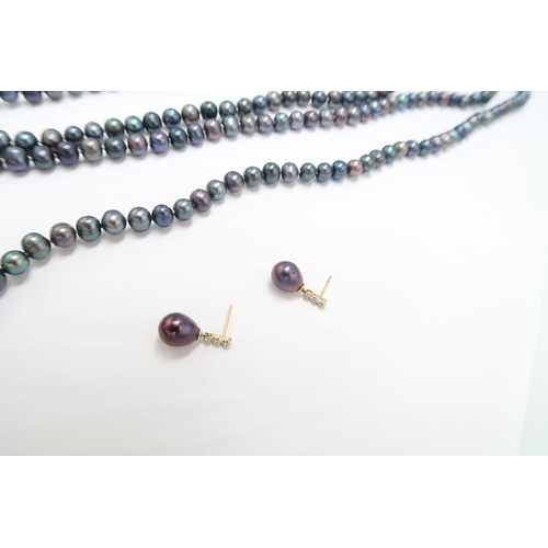 A black freshwater pearl necklace and a pair of drop earrings, fittings ...