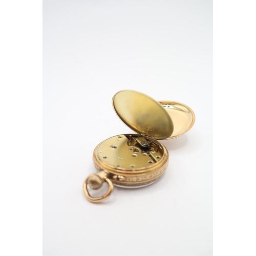 261 - An 18ct Open Faced Pocket Watch, Featuring a Scroll Worked case with gold coloured dial and black ro... 