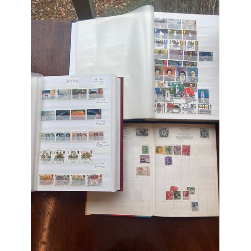 375 - Three Wessex Knight stamp albums and a Royal Mail Stamp album to include mainly British stamps, with... 