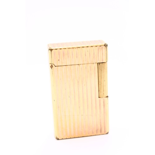 401 - S J DUPONT; A French gold plated cigarette lighter, with ribbed decoration.