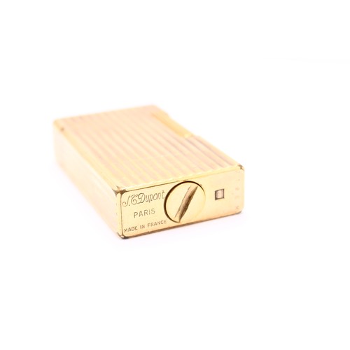 401 - S J DUPONT; A French gold plated cigarette lighter, with ribbed decoration.