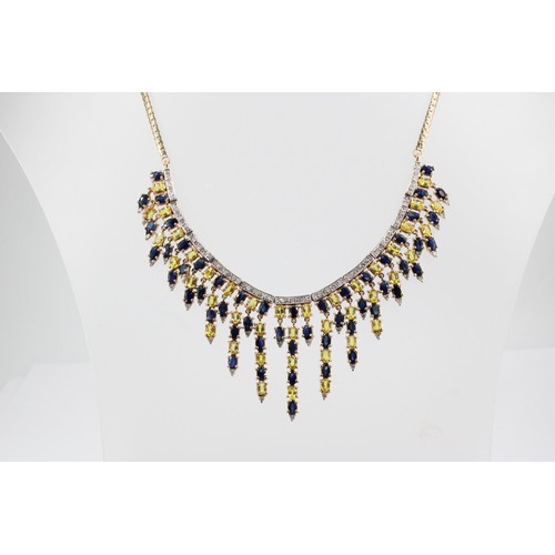 33 - A 9ct gold sapphire and diamond articulated graduated fringe centre piece necklace. Weight 41.49 gra... 