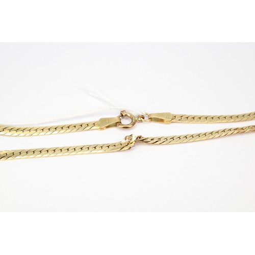 42 - A snake link chain. Stamped 14K. Weight 13.24 grams. With Kinks, 49cm.