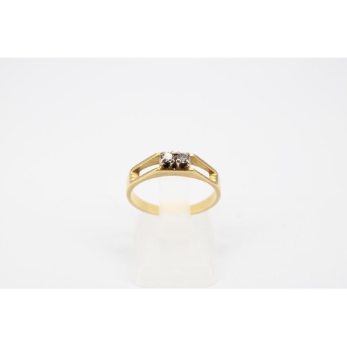 55 - An 18ct gold two stone diamond ring. Size N. Weight 3.11 grams