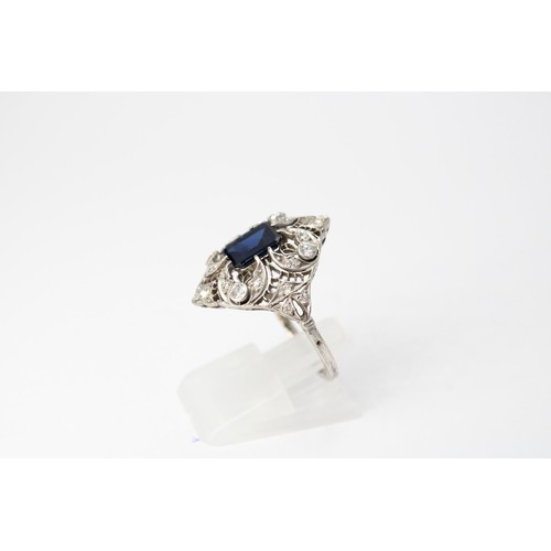59 - A sapphire and diamond openwork cluster ring. Size R. Tests silver. Weight 4.20 grams