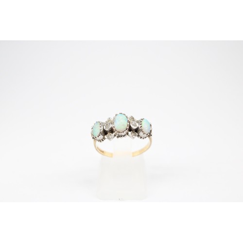 60 - A 9ct gold opal and diamond dress ring. Size P1/2. Weight 2.72 grams