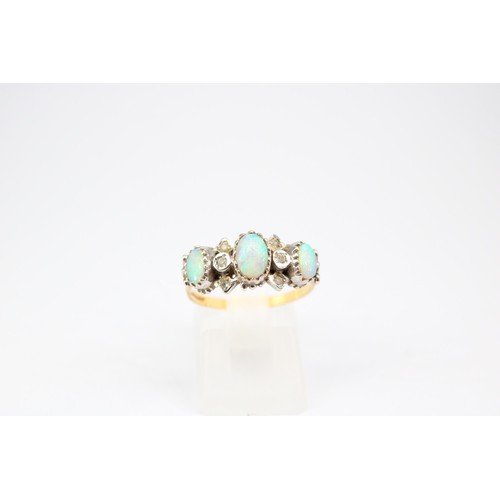 60 - A 9ct gold opal and diamond dress ring. Size P1/2. Weight 2.72 grams